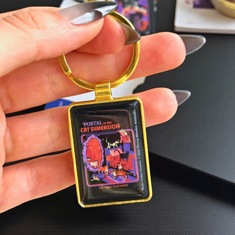 Steven Rhodes Schlüsselanhänger – „The Cat Dimension“ Retro-Motiv